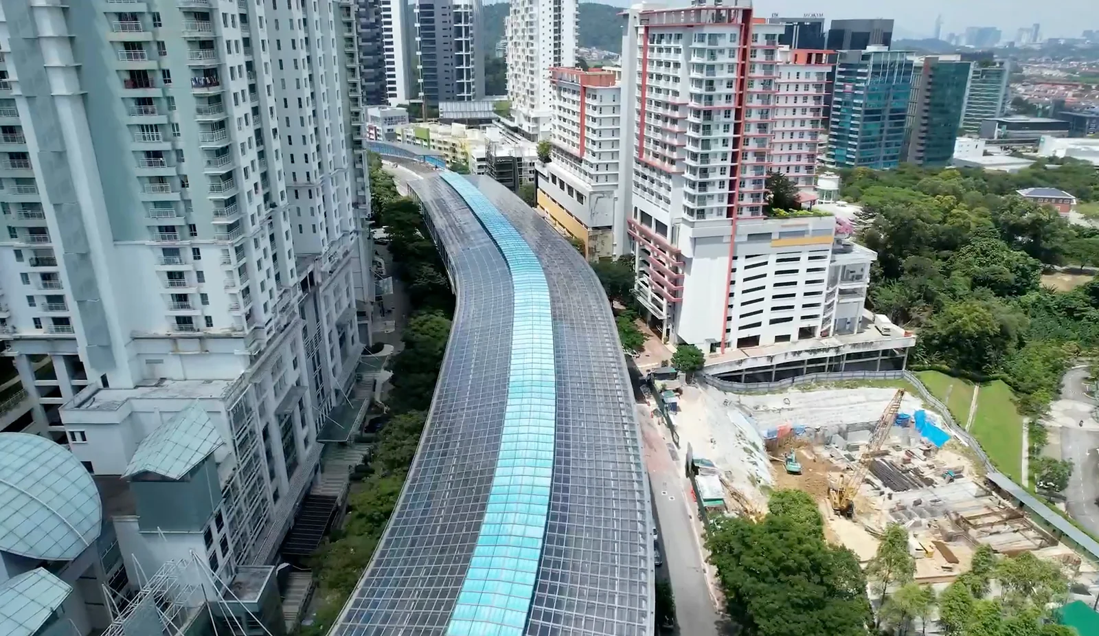 Aerial view of the DASH Expressway noise barrier enclosure between buildings